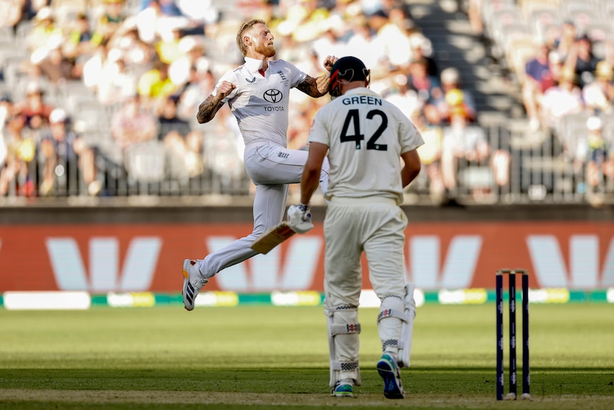 Ben Stokes leaps through the air to celebrate the wicket of Cameron Green.