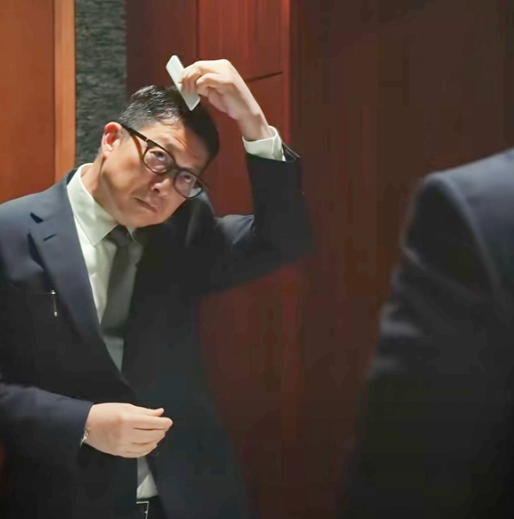 Secretary for Security Chris Tang carefully styles his hair. Photo: Handout Secretary for Security Chris Tang carefully styles his hair. Photo: Handout