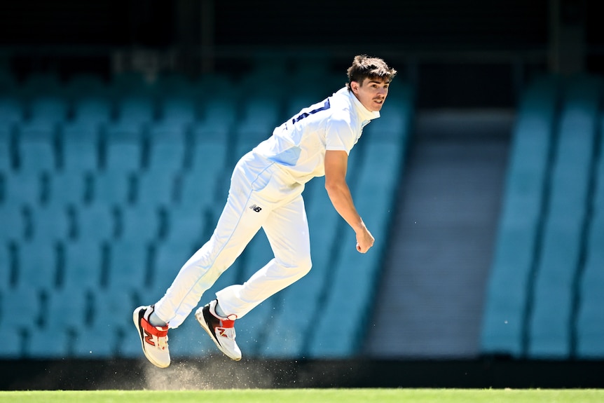 Male bowler following through after delivering a fast ball.