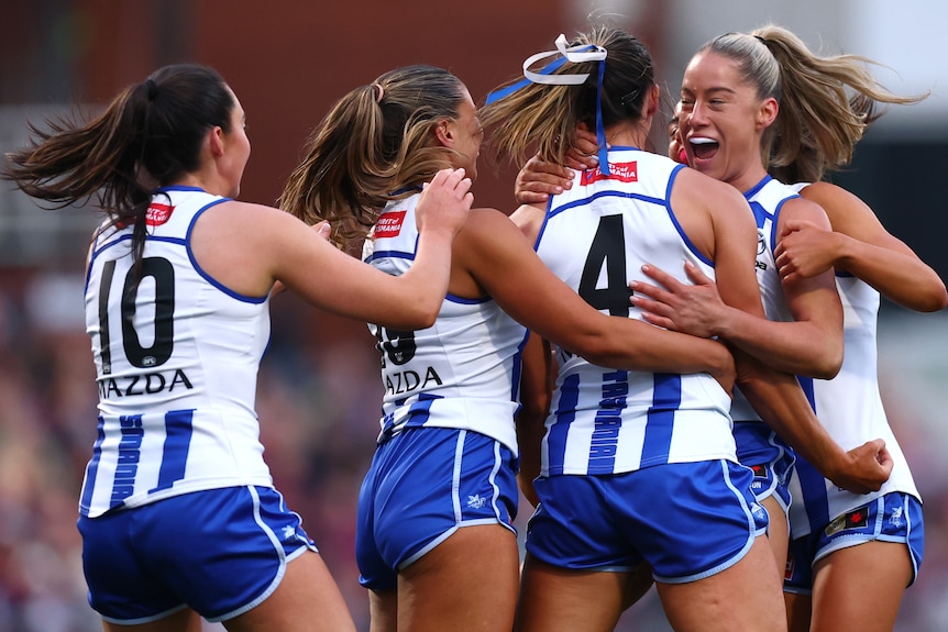 North Melbourne celebrates a goal in the AFLW grand final against the Brisbane Lions.