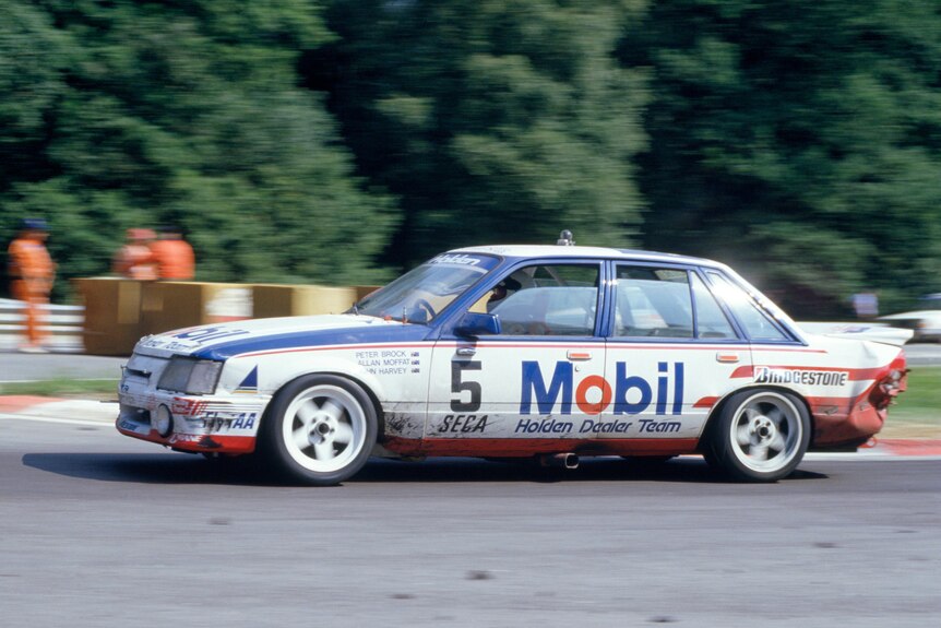A car goes around a corner during a 24 hour race 