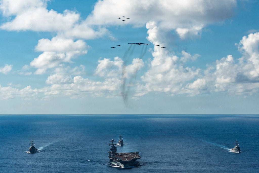 The US Navy’s Gerald R. Ford Carrier Strike Group sails towards the Caribbean Sea accompanied by Super Hornets and a B-52 Stratofortress on November 13. Photo: US Navy via Reuters