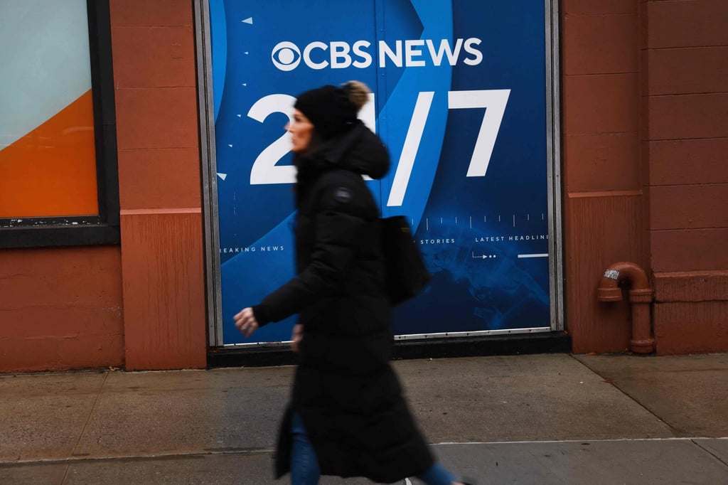 A woman walks past the CBS Broadcast Centre in New York on Tuesday. Photo: AP A woman walks past the CBS Broadcast Centre in New York on Tuesday. Photo: AP