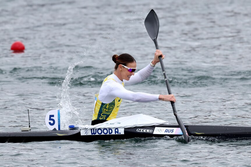 Australian Olympic kayaker Alyce Wood is paddling during an Olympic race.