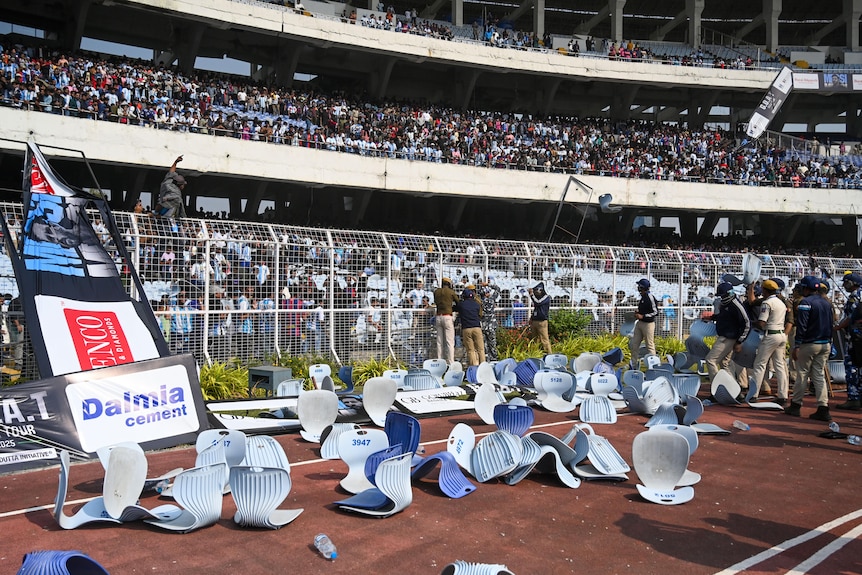 Seats on the running track in a stadium.