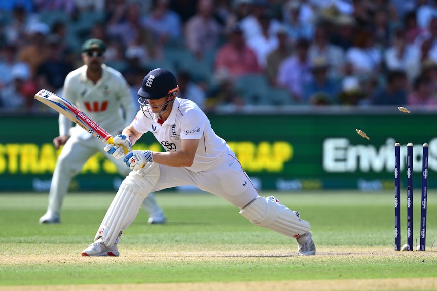 England batter Harry Brook lunges forward as he is bowled during a cricket Test.