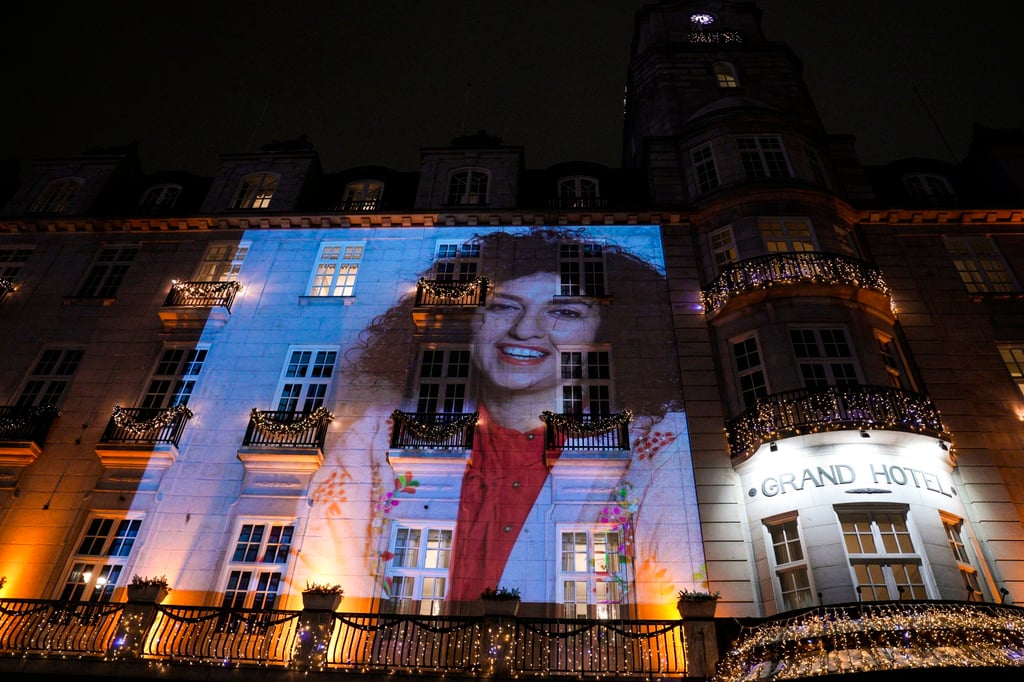 A picture of Narges Mohammadi is projected on the facade of the Grand Hotel before the Nobel Banquet in Oslo, Norway, in December 2023. Photo: EPA