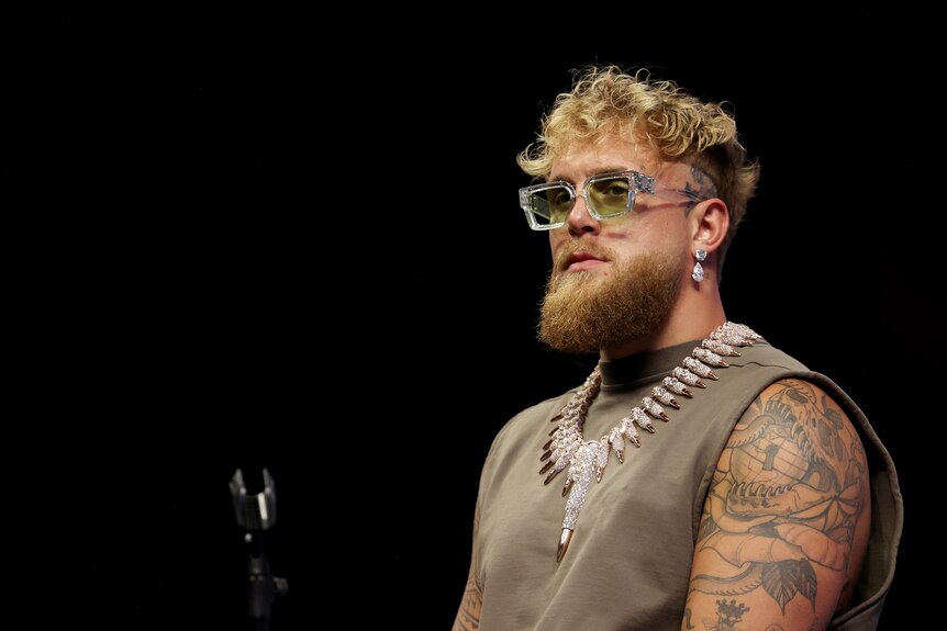 Jake Paul sits and looks out