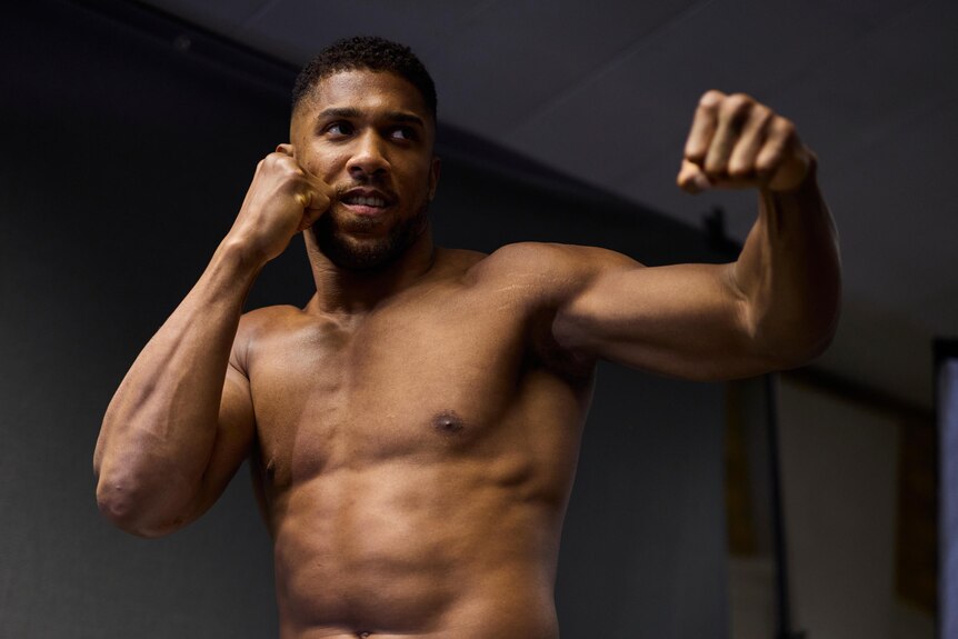 Anthony Joshua poses