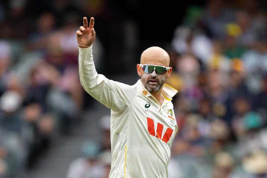 Australia bowler Nathan Lyon gestures with his right hand during a Test.