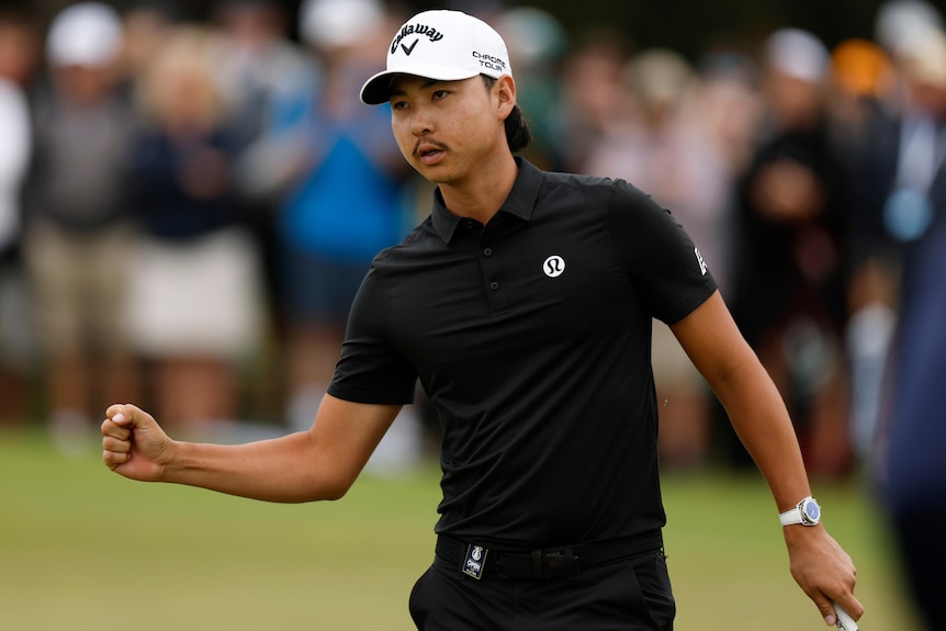 Min Woo Lee acknowledges the crowd at Australian Open.