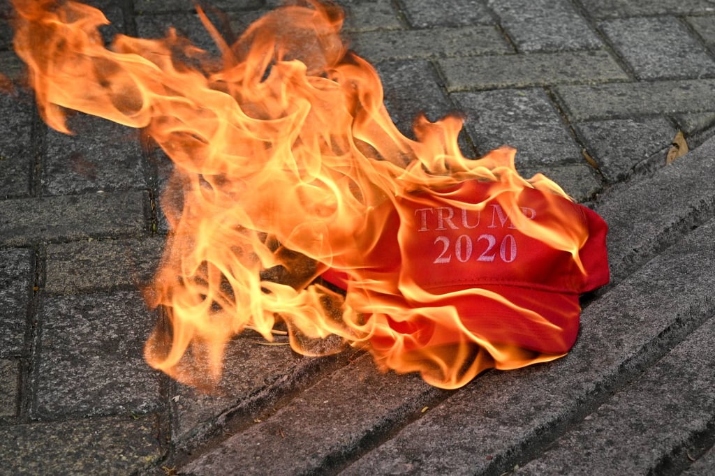 A cap that reads “Trump 2020” burns during a protest outside the US embassy in Tegucigalpa on Tuesday. Photo: AFP A cap that reads “Trump 2020” burns during a protest outside the US embassy in Tegucigalpa on Tuesday. Photo: AFP