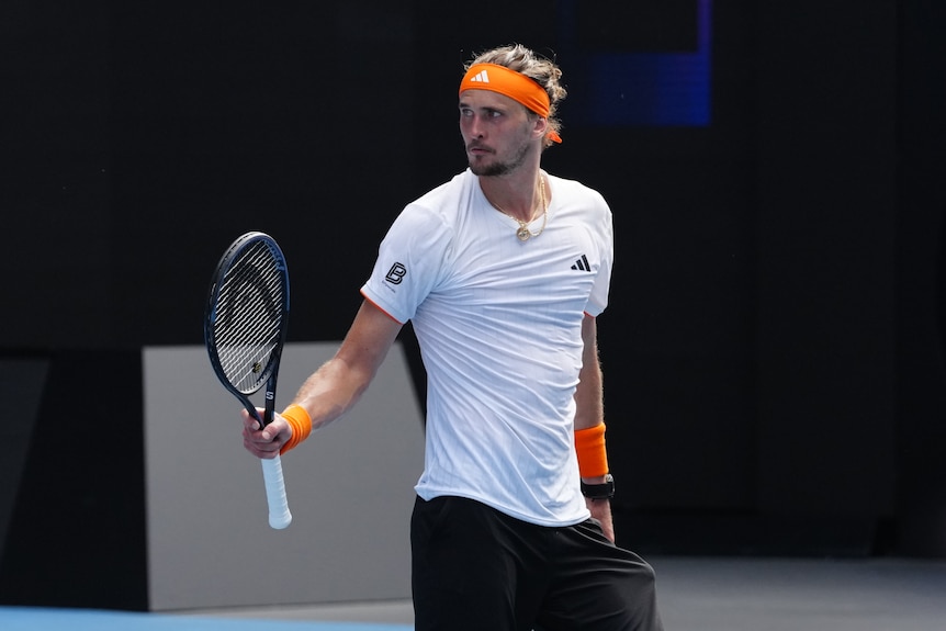 Alexander Zverev holds his racquet while celebrating a point at the Australian Open.