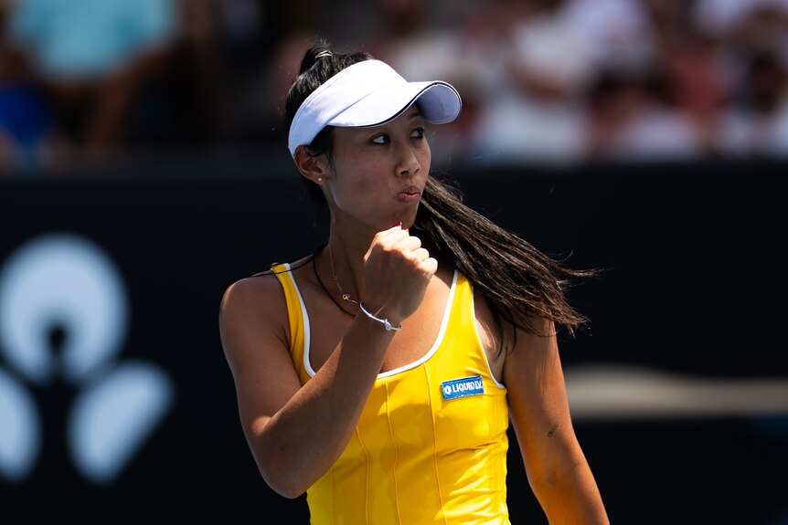 Tennis player Priscilla Hon clenches her fist at the Australian Open.