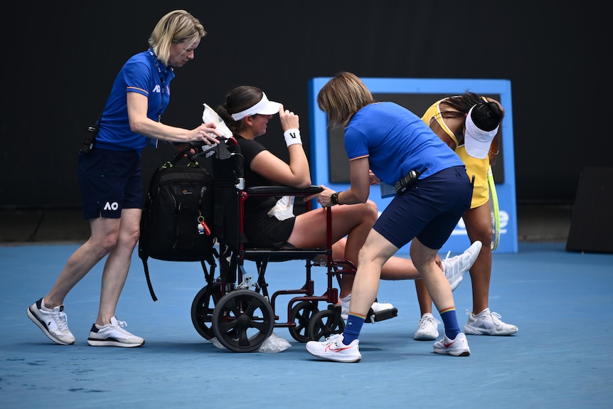 Marina Stakusic is wheeled off the court at the Australian Open.
