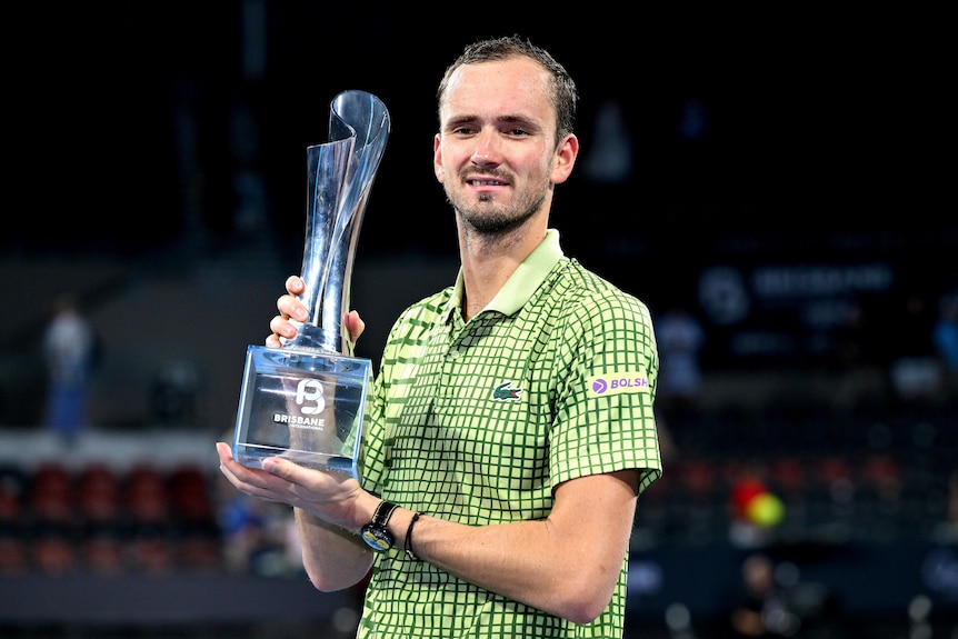 Daniil Medvedev holds a trophy