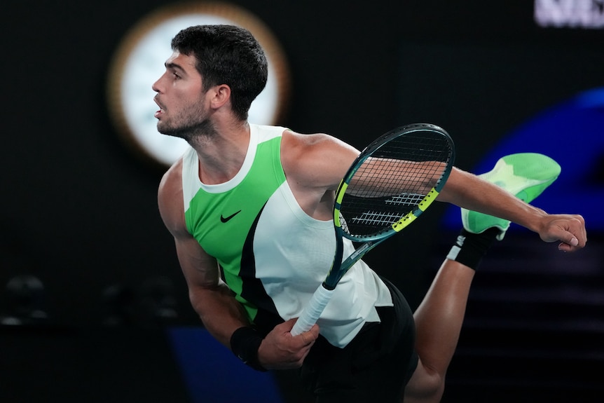 Carlos Alcaraz serves to Alex de Minaur at Australian Open.
