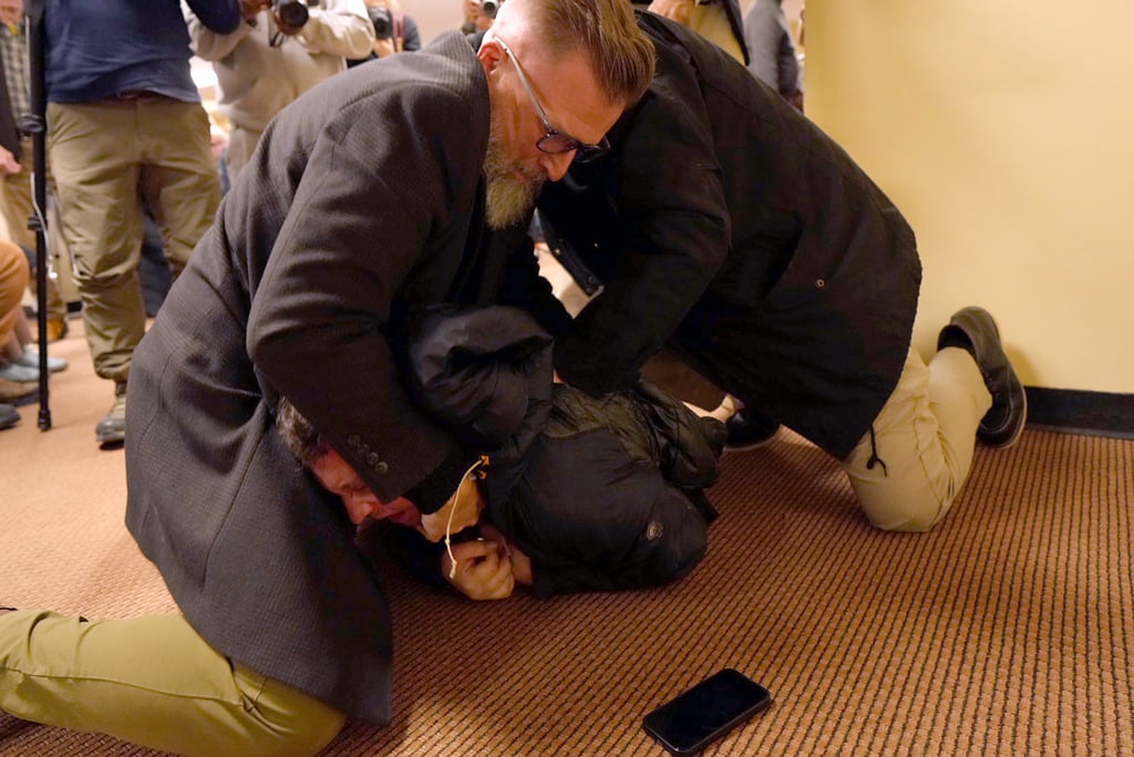 The man being tackled to the ground. Photo: Star Tribune via AP