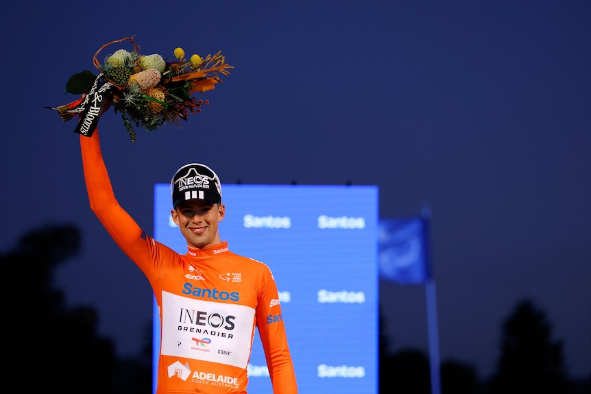 Sam Watson holds up flowers