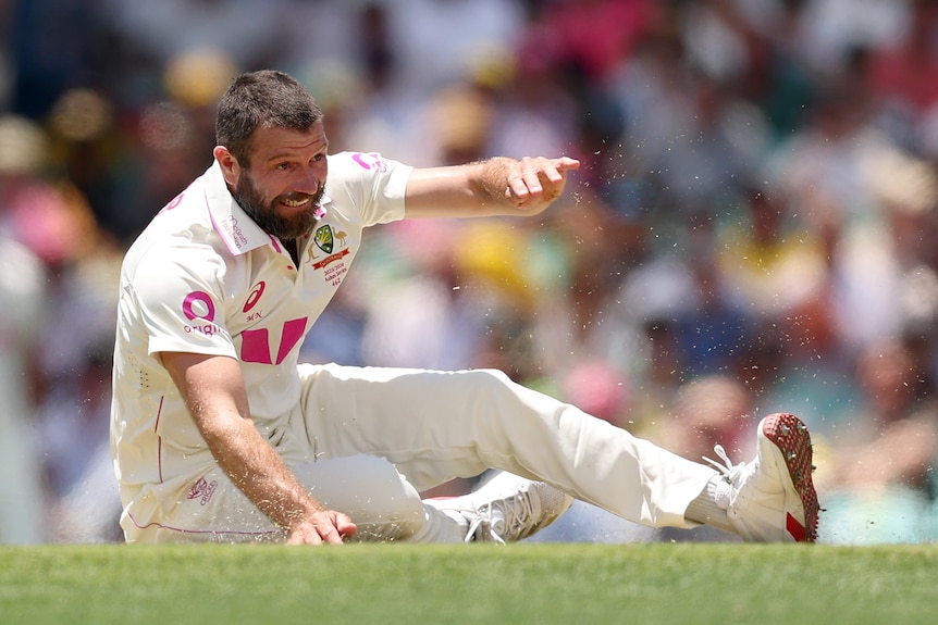 Australia bowler Michael Neser on the ground after bowling in the SCG Test.