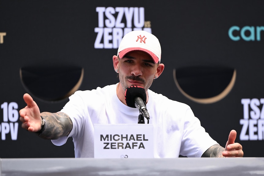 Michael Zerafa gestures at a press conference