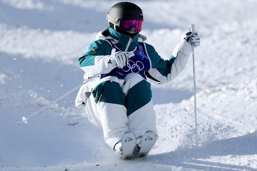 Charlotte Wilson competing in the women's moguls super final at 2026 Winter Olympics.