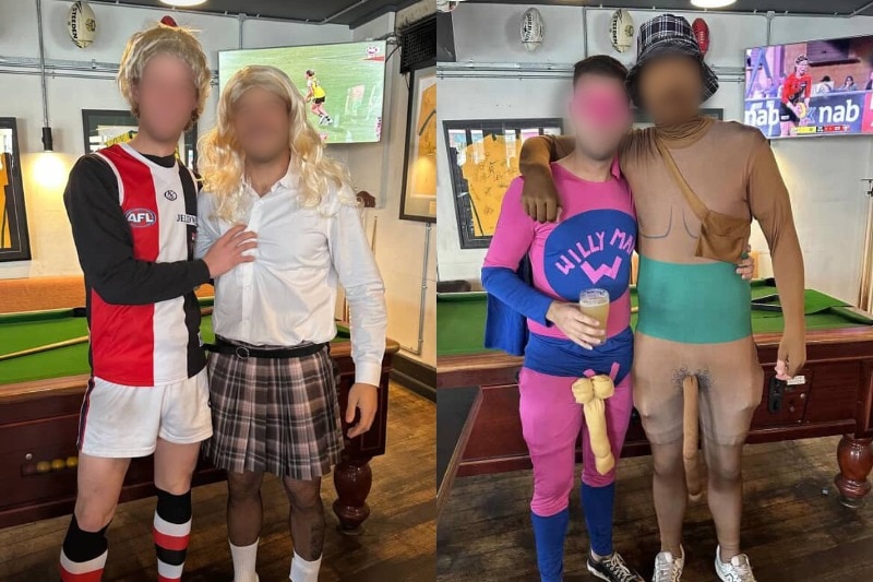 Four people in costumes. One touches another's chest.