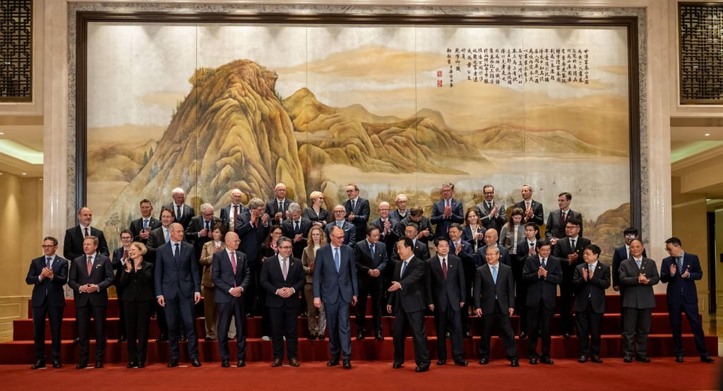 German Chancellor Friedrich Merz joins a group photo in Hangzhou. Photo: DPA