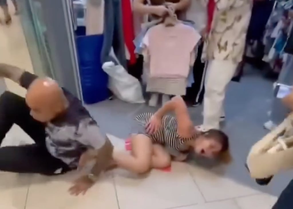A still from a social media video shows the suspect accosting the woman before kicking her as both lose balance and fall to the ground. Photo: Handout