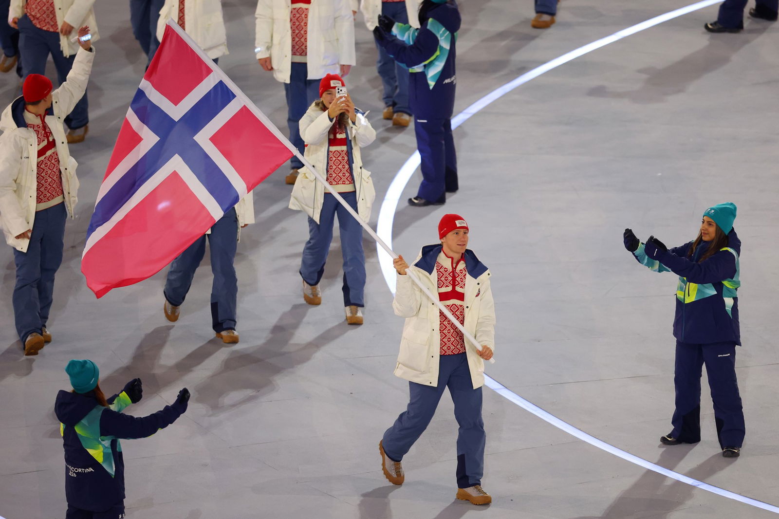 Flagbearer Peder Kongshaug of Team Norway leads the team in the parade during the opening ceremony of the Milano Cortina 2026 Winter Olympics at San Siro Stadium on February 06, 2026 in Milan, Italy.
