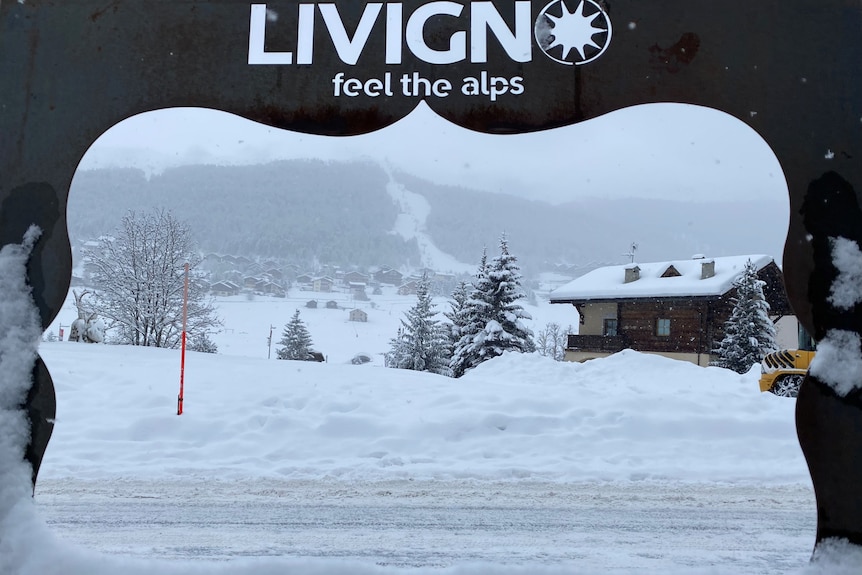 Livigno sign as snow falls