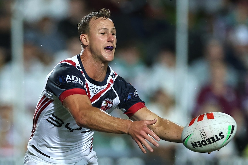Daly Cherry Evans passes the ball