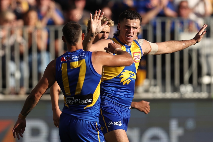 Jake Waterman celebrates a goal with West Coast teammates