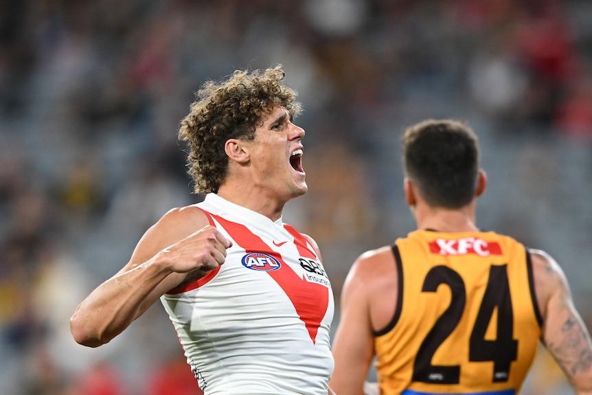 Charlie Curnow of the Sydney Swans pumps his fist after kicking a goal