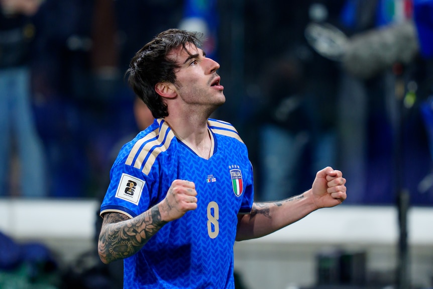 Italian footballer Sandro Tonali pumps his fists to celebrate a goal.