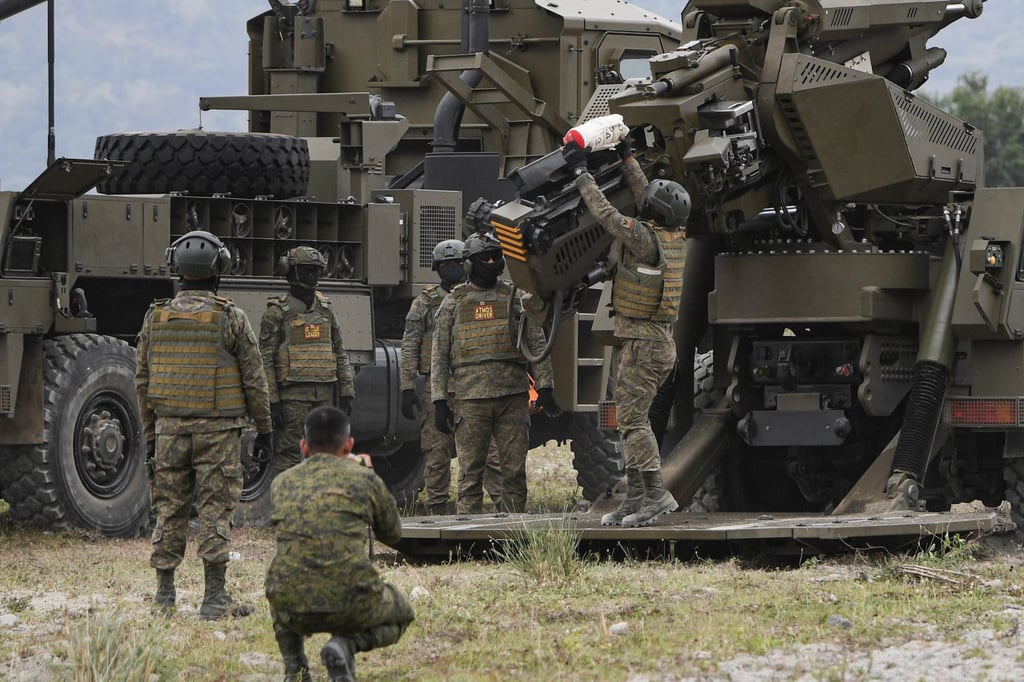 Philippine soldiers load ammunition into an Autonomous Truck Mounted Howitzer System during a live-fire exercise in Tarlac province in 2024. Photo: AFP Philippine soldiers load ammunition into an Autonomous Truck Mounted Howitzer System during a live-fire exercise in Tarlac province in 2024. Photo: AFP