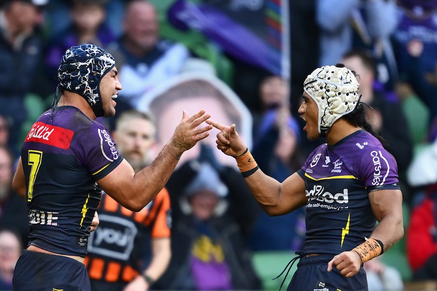 Jahrome Hughes and Sua Fa'alogo celebrate an NRL try 