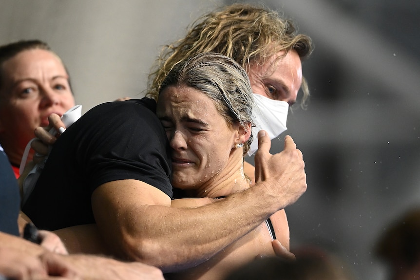 Shayna Jack cries as she is hugged by her coach Dean Boxall