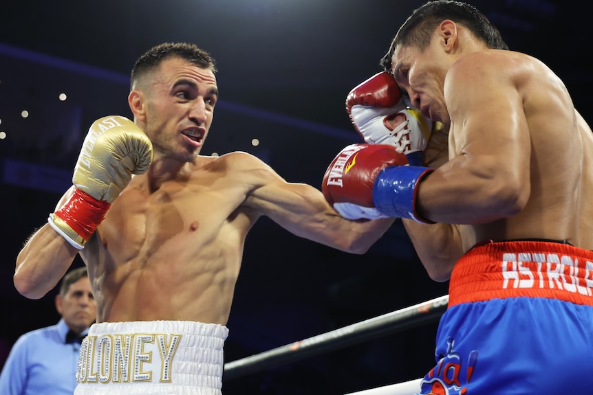 Jason Moloney punches Vincent Astrolabio