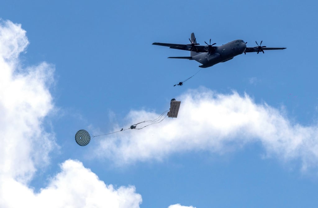 A Lockheed Martin C-130 “Hercules” drops military equipment during exercises near Vilnius, Lithuania, on May 16, 2025. The aircraft is considered America’s premier medium-lift transport. Photo: AP