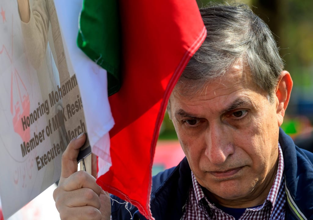 Glenn Torshizi, whose brothers were executed by the Iranian government, joins others in a picket line at the US State Department to highlight the executions of MEK members on Monday. Photo: AP Glenn Torshizi, whose brothers were executed by the Iranian government, joins others in a picket line at the US State Department to highlight the executions of MEK members on Monday. Photo: AP