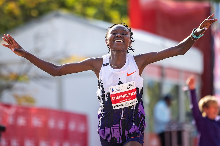 Ruth Chepngetich raises her arms
