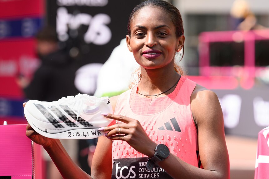 Tigst Assefa with her shoe