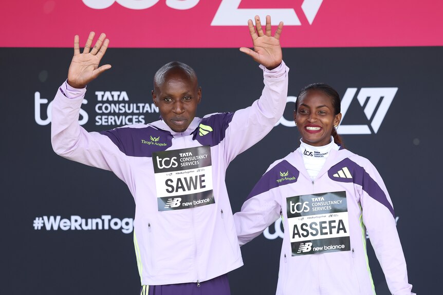 Sabastian Sawe and Tigst Assefa smile