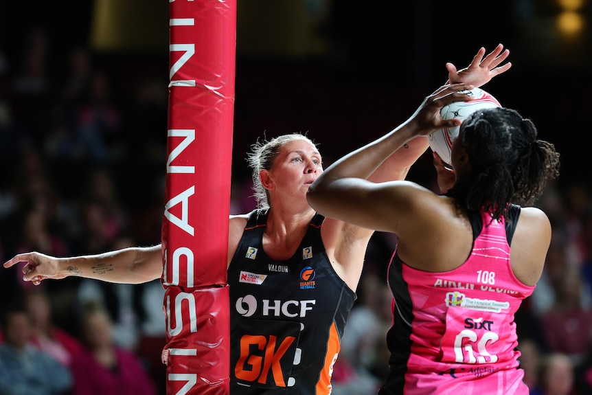 Casey Kopua of the Giants attempts to block a shot