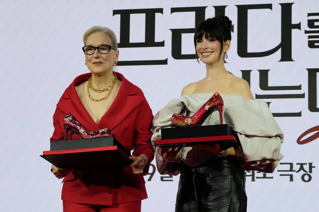 Actresses Meryl Streep, left, and Anne Hathaway pose after receiving gifts during a recent press conference to promote the film in South Korea. Photo: AP