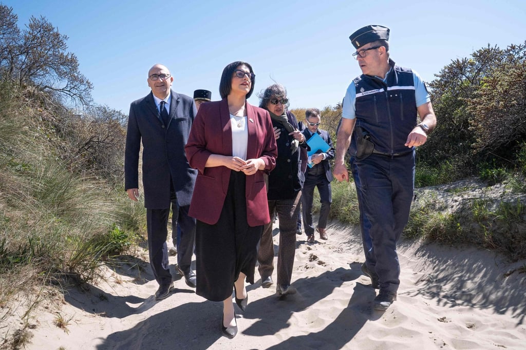 Britain’s Home Secretary Shabana Mahmood (centre) walks with France’s Interior Minister Laurent Nunez (left) and French police officers as they attend a presentation of the operational resources used to counter illegal immigration, on the shores of Zuydcoote, near Dunkirk, northern France, on April 23. Photo: AFP