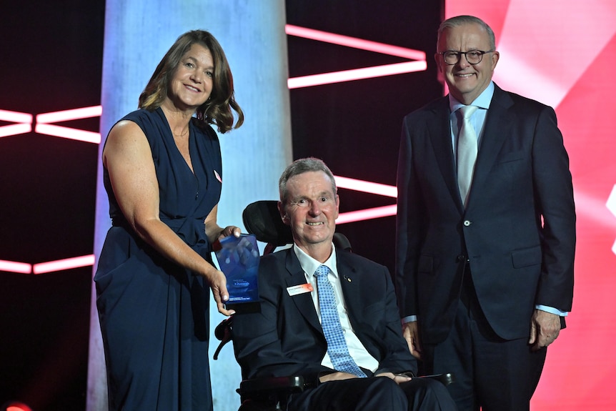 Neale Daniher, wife Jan and Prime Minister Anthony Albanese on the AOTY. 