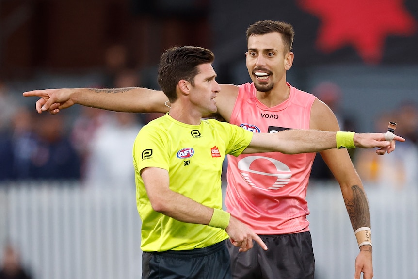 Matt Stevic, and Joel Jeffrey point in opposite directions