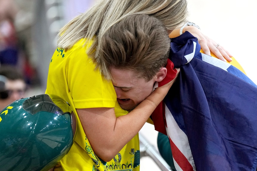 Matt Glaetzer hugs his wife
